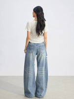 Distressed Curved Wide-Leg Jeans
