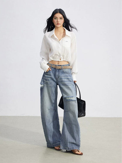 Distressed Curved Wide-Leg Jeans