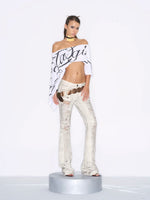 Distressed Low-Rise Flare Jeans