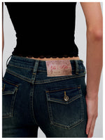 Washed Raw-Edge Belted Flare Jeans